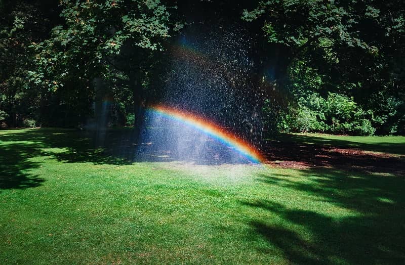 Rainbow at home with garden sprinklers